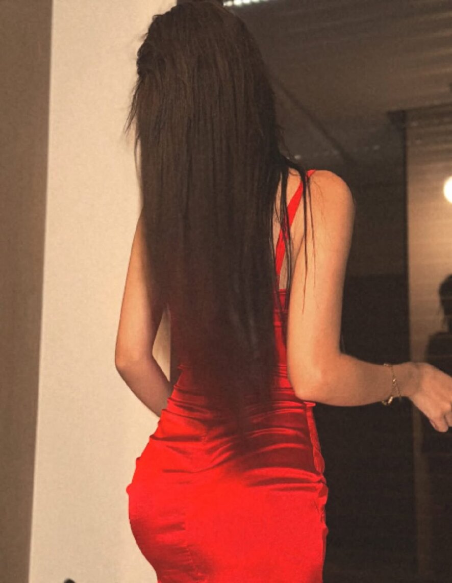 A woman in deep thought her expression suggestive