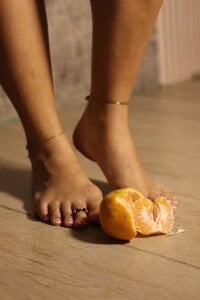 goddessfeetxx squashing a tangerine Pic