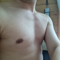 Young cam beauty plays with his giant cock